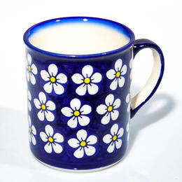 cobalt blue cup with big white flowers