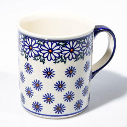 white ceramic cup with cobalt blue flowers