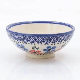 small japanese shaped bowl with red and blue flowers